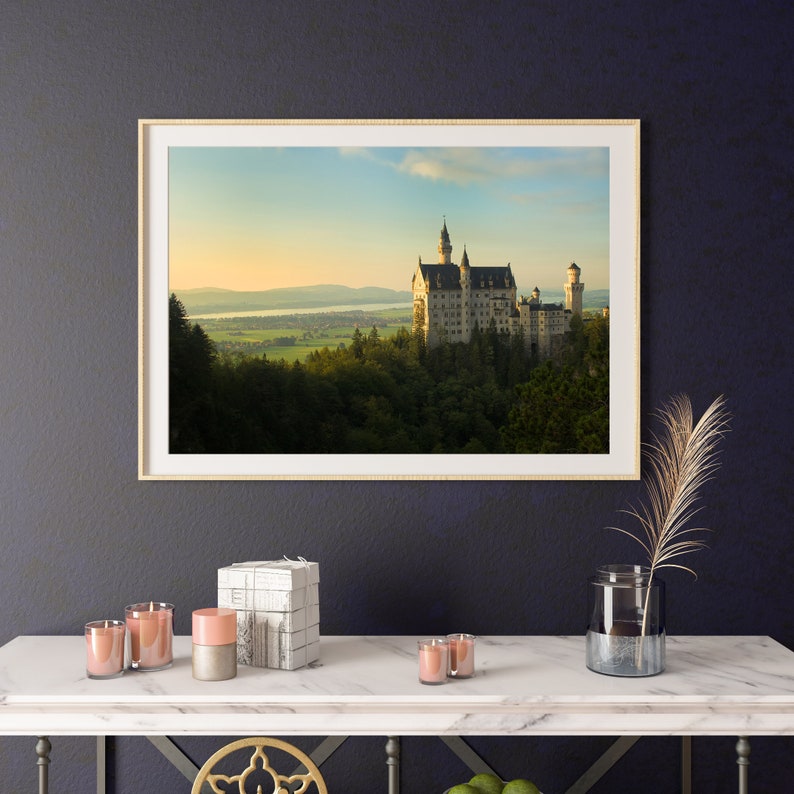 A framed photographic print of Neuschwanstein Castle in Germany.