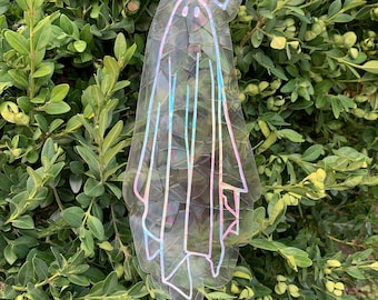 May include: A holographic iridescent sticker of a ghost with a heart above its head. The ghost is outlined in black and has a simple face.