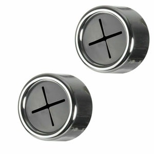 May include: Two silver and black round dish towel holders with a cross-shaped opening in the center.