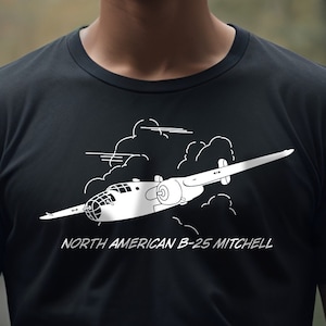 May include: A black t-shirt with a white graphic of a North American B-25 Mitchell bomber plane flying through clouds. The text "NORTH AMERICAN B-25 MITCHELL" is printed below the plane.