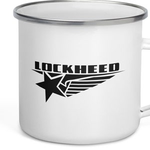 May include: White enamel mug with a black Lockheed logo featuring a star and wing design.