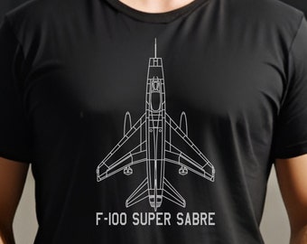 May include: A black t-shirt with a white outline of an F-100 Super Sabre jet aircraft. The text "F-100 Super Sabre" is printed below the aircraft.