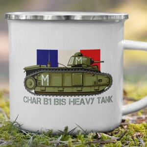 May include: White enamel mug featuring a green and brown illustration of a French Char B1 bis heavy tank with the text "CHAR B1 BIS HEAVY TANK". The tank is shown with a French flag and the letter "M" on the side.
