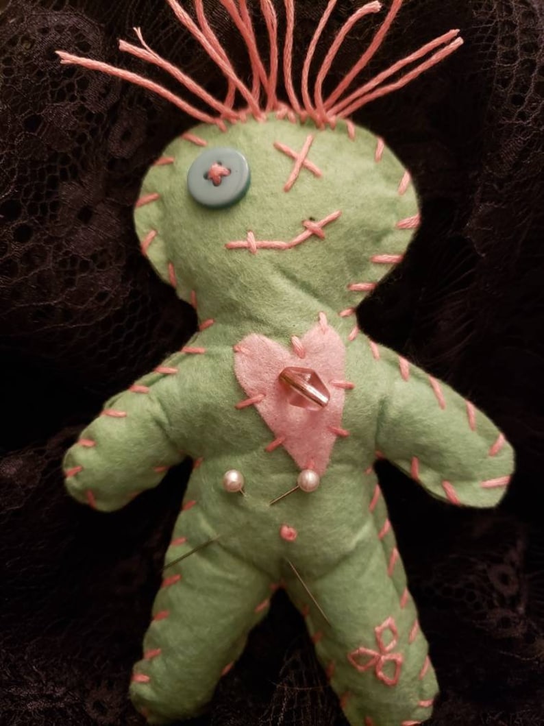 witch with voodoo doll