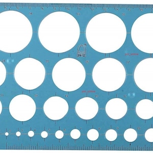 May include: A blue plastic circle template with 29 different sized circles ranging from 1 cm to 35 cm in diameter. The template is labelled "OMEGA CIRCLE TEMPLATE ART NO. 1909 - INDIA".