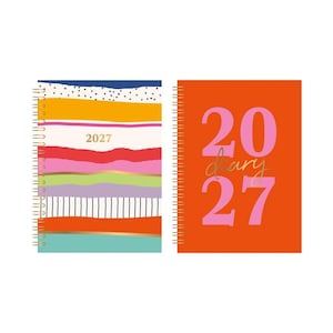May include: Two spiral-bound 2027 diaries. The left diary features horizontal stripes in navy, yellow, pink, red, lavender, and teal with the text 2027. The right diary is solid orange with large pink 2027 text and the word diary in gold script.
