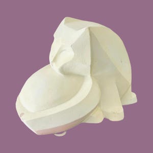 May include: A white, abstract sculpture with geometric shapes and a rounded base. The sculpture has a light pink accent on the base and a curved, hook-like detail. The artwork is set against a purple background.