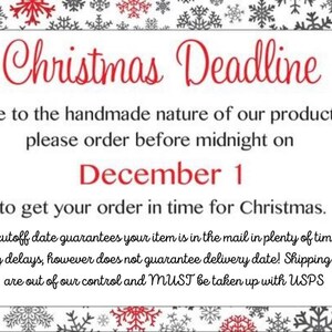 May include: A white card with red text that reads "Christmas Deadline". The text explains that due to the handmade nature of the products, orders must be placed before midnight on December 1st to ensure delivery by Christmas. The card has a snowflake border.