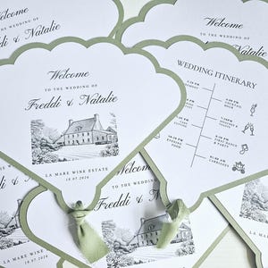 May include: Fan-shaped wedding programmes with sage green borders and sage green ribbon accents. The front features a black and white illustration of La Mare Wine Estate, the text Welcome to the wedding of Freddi & Natalie, and the date 18.07.2026.