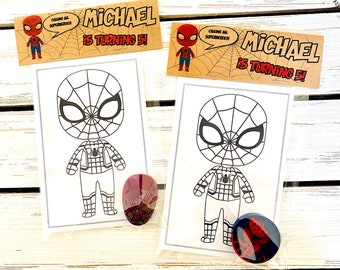 May include: Two Spiderman-themed coloring pages with a small red and black Spiderman sticker on each. The pages are in clear plastic bags. The top of each bag has a brown banner with the text "Calling all superheroes! Michael is turning 5!"