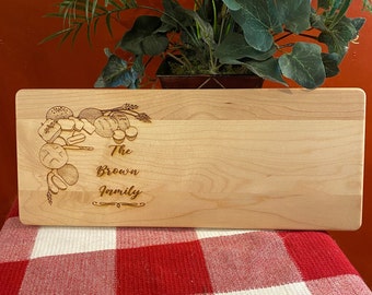 Personalized and Engraved Wood Charcuterie Cutting Board with Breads and Grains on the left side of board