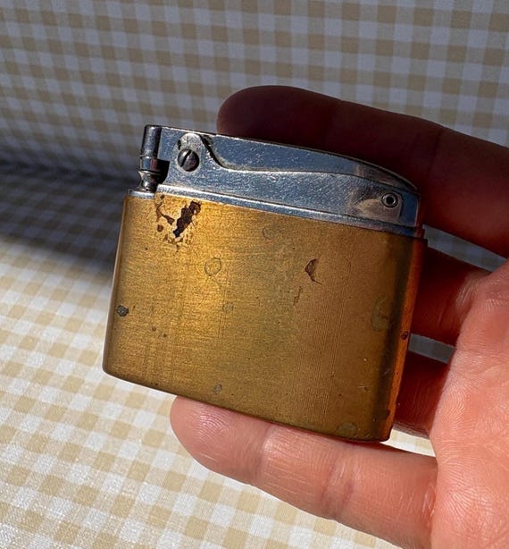 1950's cigarette lighters Other Brands  Shop High-End and Vintage  Elegant Lighters :: Selling & repairing high-end and vintage lighters since 1957!  S.T. Dupont, Alfred Dunhill, IM Corona, Zippo, Ronson, Evans Lighters or for wear on a neckchain. 1950s bank advertising flat cigarette