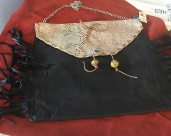 Goatskin faux snake cowhide envelope shoulder bag silk lined with snap closure. 11x12
