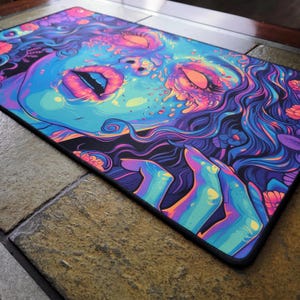 Beautiful zombie MTG playmat perfect for zombie Commander mtg card games. Pushing Up Daisies MTG Zombie Playmat & Gaming Desk mat with stitched edges comes in a large oversized mouse pad too. Perfect for any gamer accessories fitting a horror or psychedelic desk aesthetic. Its also a unique Dia De Los Muertos Playmat for tcg games. This is a black light reactive playmat.