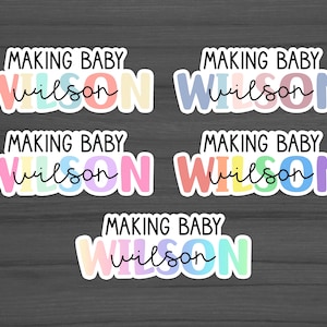 May include: A collection of colorful stickers with the text "MAKING BABY Wilson" in various pastel color schemes. The word "MAKING BABY" is in a bold, sans-serif font, while "Wilson" is in a cursive font.