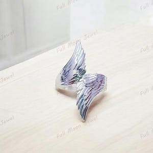 Feather band ring in silver, minimalist and inspirational jewelry.