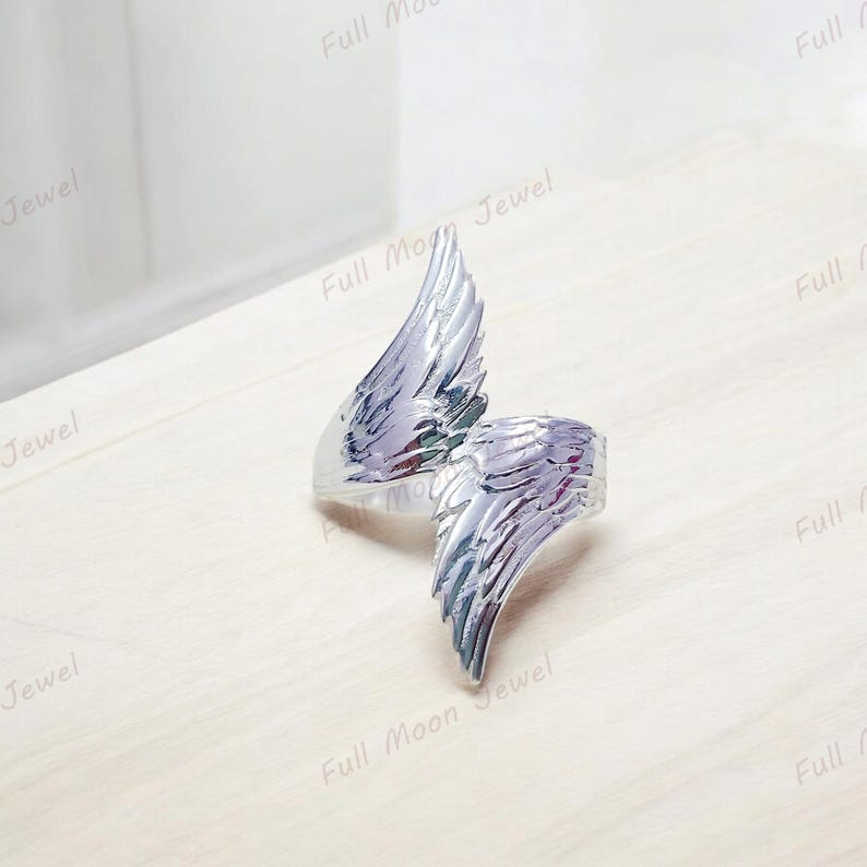 Feather band ring in silver, minimalist and inspirational jewelry.
