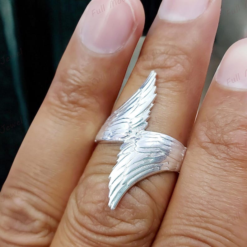 Symbolic guardian angel ring, elegant and minimal design.