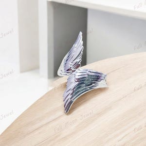 Silver adjustable feather ring for men and women.