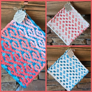 May include: Three handmade woven pot holders in a diamond shape. One is blue, coral, and turquoise. Another is white and pink. The third is white and blue. Each has a tag that says "Handmade by Julies Loom".