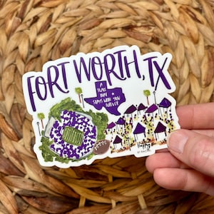 May include: A white sticker with a purple and green illustration of a football stadium and the text "Fort Worth, TX" and "A place that stays with you forever". The sticker also includes a small illustration of the state of Texas with a star.