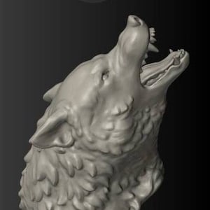 May include: A gray sculpture of a wolf's head, captured in mid-howl. The wolf's mouth is wide open, revealing teeth and a detailed tongue. The fur is textured, and the sculpture is set against a dark background.