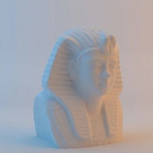 May include: White plaster bust of an Egyptian pharaoh with a headdress and a detailed face.