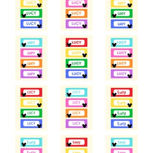 May include: A set of 12 printable name tags featuring the name "Lucy" in different fonts and colors. Each tag has a black Mickey Mouse silhouette.