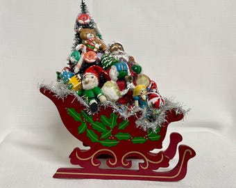 Vintage Red Wooden Santa Sleigh: Nostalgic Christmas Centerpiece