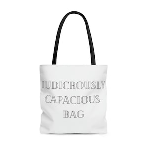 May include: White tote bag with black handles and the text "Ludicrously Capacious Bag" printed in black.