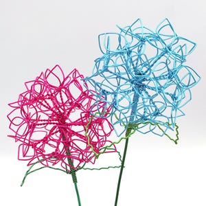 May include: A rustic wooden sign with the text "Welcome to our home" in a handwritten style. The sign has a distressed finish and a simple, inviting design, ideal for entryway decor.