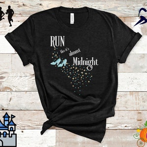 May include: Black t-shirt with the text "Run like it's almost Midnight" in white script. The design includes light blue Cinderella glass slippers and a trail of stars. The shirt is tied at the bottom.