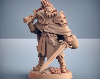 May include: A miniature figurine of a fantasy character wearing a brown cloak and holding a sword. The character has a detailed face with a single eye and a spiky hairstyle.