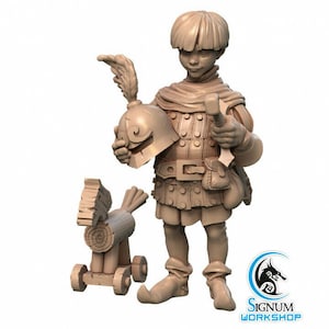 May include: A tan-coloured figurine of a young person in medieval attire, holding a helmet with a feather and a hammer. A wooden toy horse with wheels stands nearby. The figurine has a detailed design and is set against a white background.