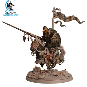 May include: A miniature figure of a knight riding a horse, both are painted in gold and white. The knight is wearing armor and holding a spear. The horse has a saddle and a bridle. The figure is standing on a base with a brown and gray textured surface. The knight is holding a banner with the text "SIGNUM WORKSHOP".