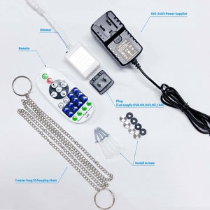 May include: A white LED light strip kit with a remote control, dimmer, power adapter, plug, hanging chain, and installation screws. The remote control has buttons for on/off, color selection, brightness, and timer functions.