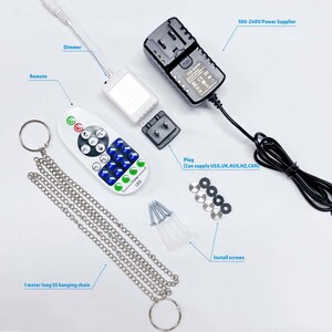 May include: A white LED light strip kit with a remote control, dimmer, power adapter, plug, hanging chain, and installation screws. The remote control has buttons for on/off, color selection, brightness, and timer functions.