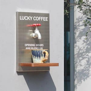 May include: A stainless steel sign with the text "LUCKY COFFEE" and "OPENING HOURS AM8:30-PM22:00". A faucet with a red handle is mounted above a wooden shelf holding a blue and white ceramic mug with a tan handle.