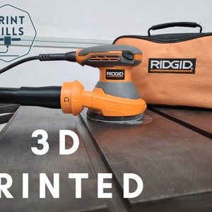 May include: An orange and black 3D printed dust collection adapter for a Ridgid sander. The sander is in a black and orange carrying case with the Ridgid logo. The text "3D PRINTED" is visible in the image.