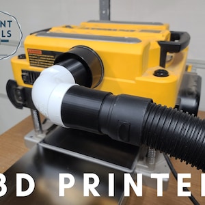 May include: A 3D printed adapter for a yellow power planer, connecting a black dust hose to the planer's dust port. The adapter is white and black and has a 90-degree bend. The text "3D PRINTED" is visible in the image.