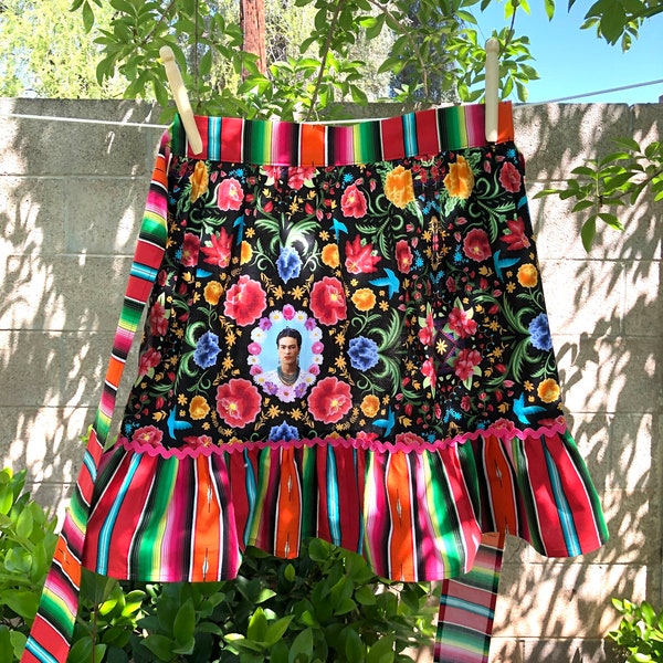 Vintage-Inspired Half Apron with Ruffle - Frida Kahlo Vibrant Floral with Colorful Striped Fabric and Bright Pink Rick Rack Trim.