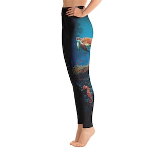 May include: Black yoga leggings with a colorful underwater scene featuring a sea turtle, coral, and a seahorse.