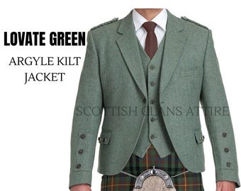 May include: A three-piece Lovate Green Argyle Kilt Jacket. The jacket and vest are a muted green color, with a matching tie. The kilt is visible at the bottom, featuring a plaid pattern. The text "Scottish Clans Attire" is printed on the jacket.