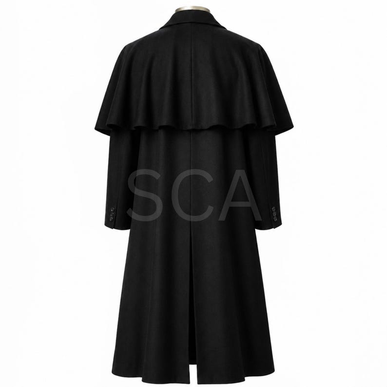 May include: A black long coat featuring a shoulder cape overlay, a structured collar, long sleeves with three buttons at each cuff, and a central back vent. The garment is displayed from the back view, showcasing a smooth, solid black fabric.