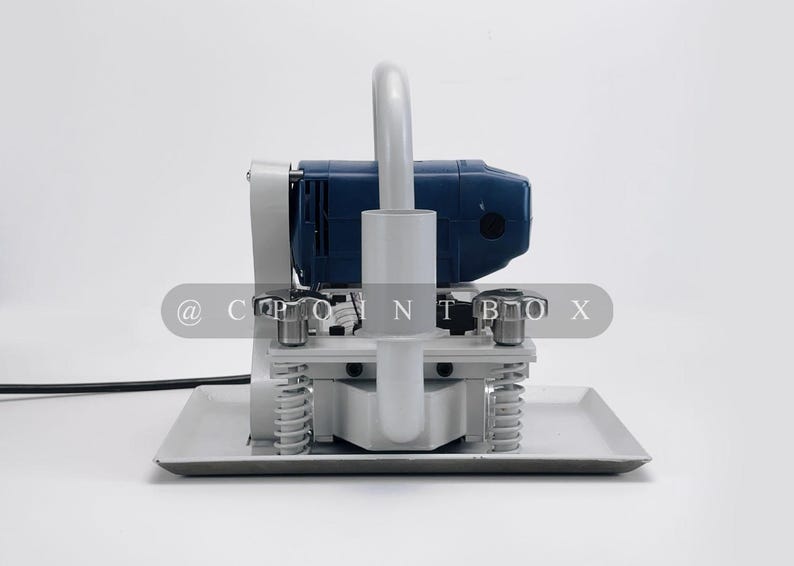 May include: A blue and gray concrete floor grinder with a handle and a base plate. The grinder has a power cord and a switch.