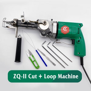 May include: A green and black electric ZQ-II Cut + Loop Machine with a black handle and a cord. The machine is surrounded by various tools, including a pair of green scissors, a blue needle, and four silver metal tools.