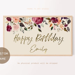 Puede incluir: Impresi&oacute;n art&iacute;stica rectangular enmarcada con un marco de madera clara. La parte superior presenta un arreglo floral de acuarela en tonos burdeos, melocot&oacute;n y verde. Las palabras "Happy Birthday Emily" est&aacute;n en escritura dorada. Un c&iacute;rculo con "Custom Name" est&aacute; en la esquina inferior izquierda.