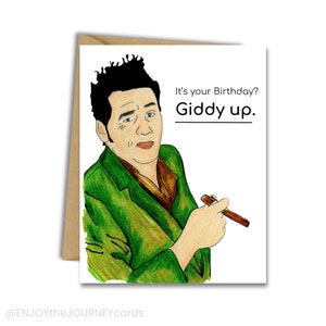 May include: A birthday card featuring a cartoon illustration of a man with a mustache and a cigar, with the text "It's your Birthday? Giddy up."