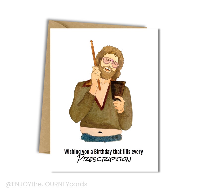 May include: A greeting card with a cartoon illustration of a man with a beard and glasses holding a drumstick and a cowbell. The text on the card reads "Wishing you a Birthday that fills every PRESCRIPTION".
