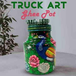 May include: A hand-painted green glass jar with a peacock design and floral accents. The jar features a blue peacock, pink and white roses, and the text "TRUCK ART Ghee Pot". The jar has a decorative lid.